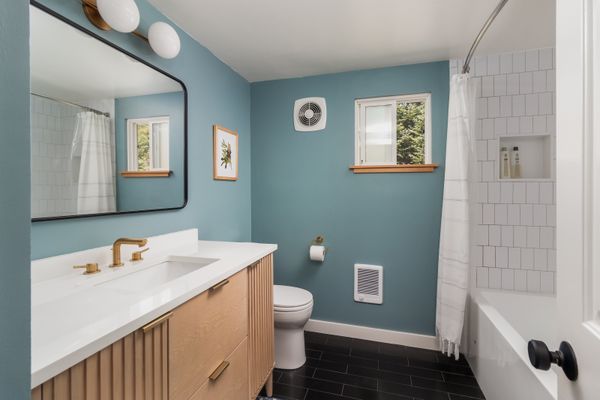 Full bathroom with tub and vanity